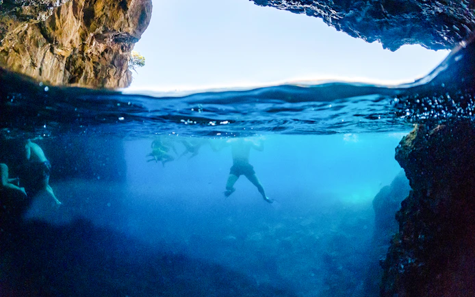 Swimming near blue caves in Dubrovnik, Croatia.