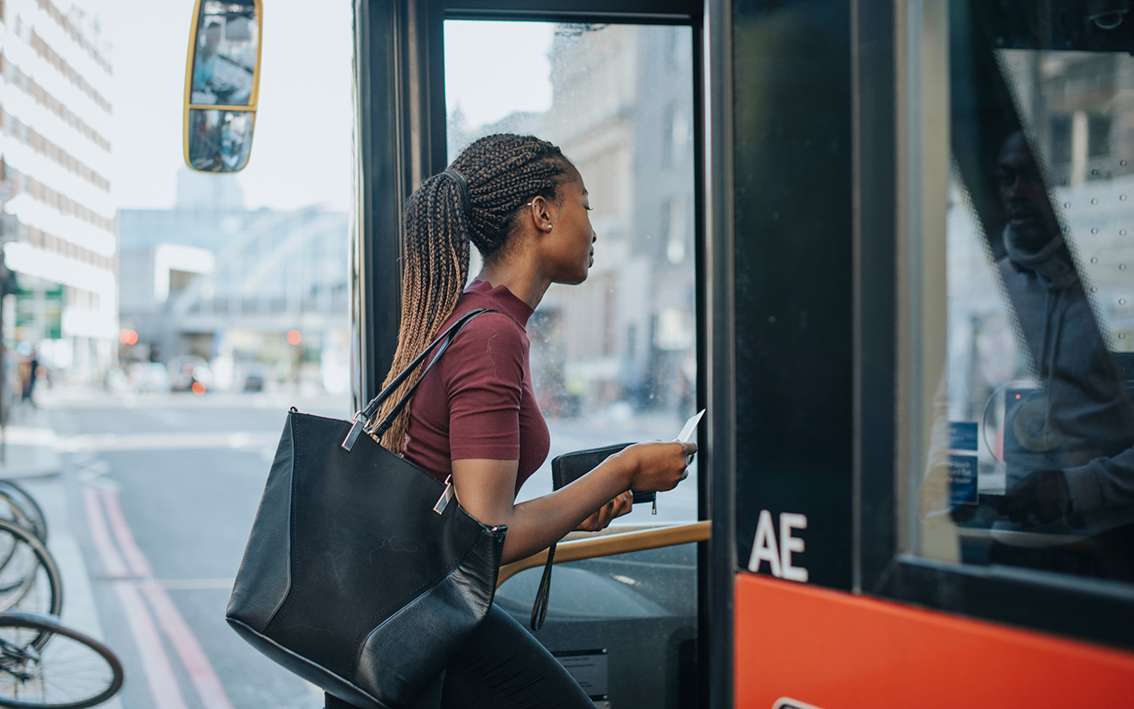 women getting on bus