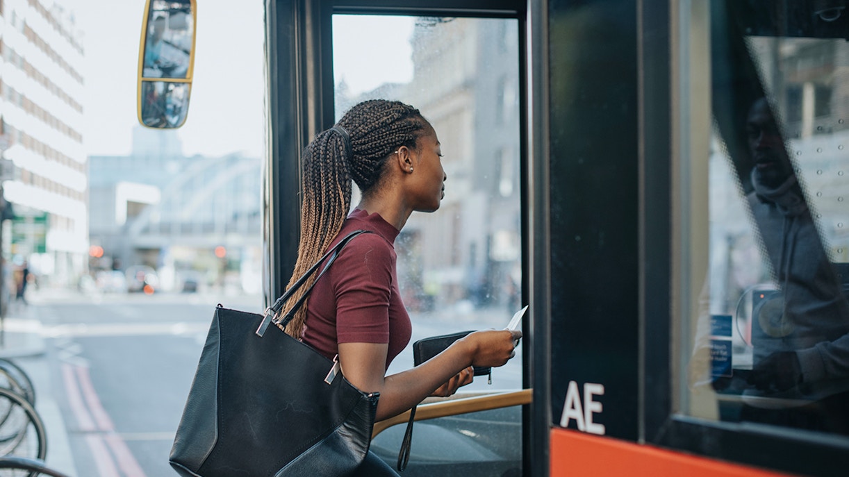 women getting on bus