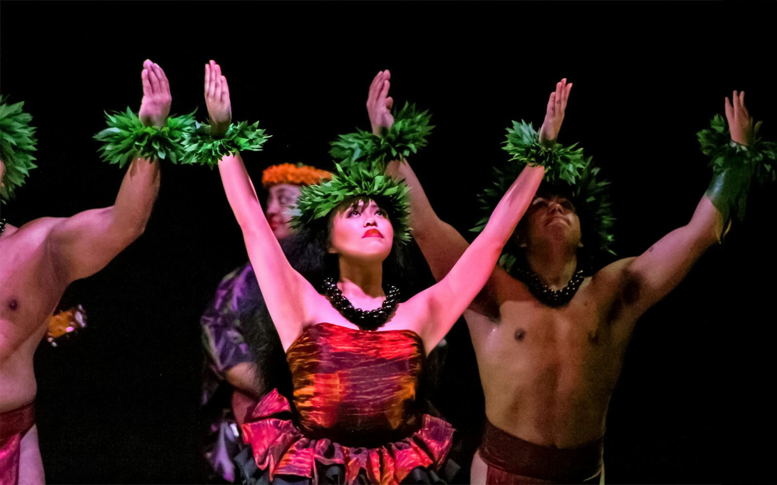Performers dancing at a traditional Hawaiian luau, Moana Luau, Hawaii.