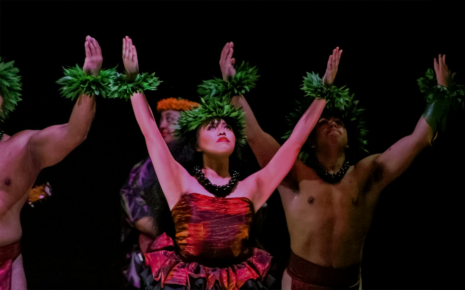 Performers dancing at a traditional Hawaiian luau, Moana Luau, Hawaii.