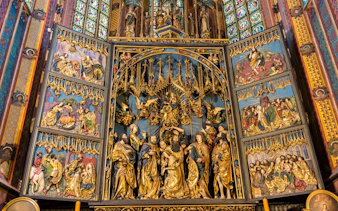 St. Mary's Basilica altar with intricate religious carvings, Krakow Guided Tour.
