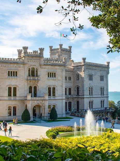 Miramare Castle with gardens and fountain overlooking the Gulf of Trieste on Hoptour.
