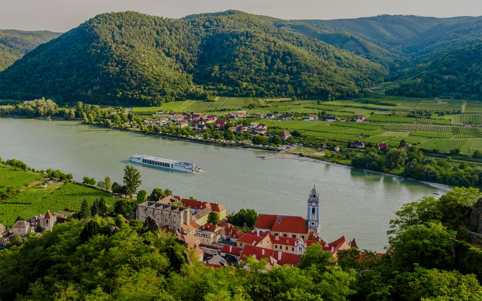 Dürnstein town on Danube River, Wachau, Lower Austria, with historic buildings and scenic landscape.