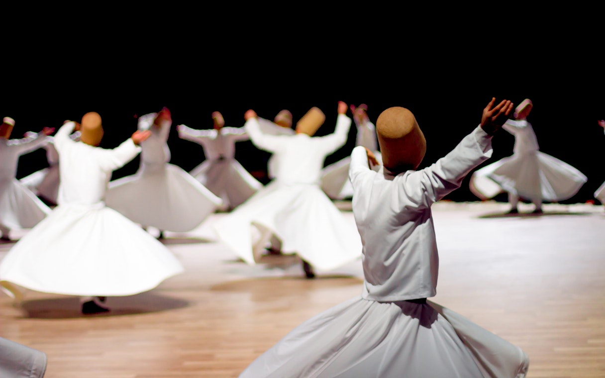 Whirling dervishes performing in Istanbul, Turkey, part of the Istanbul Welcome Card experience.