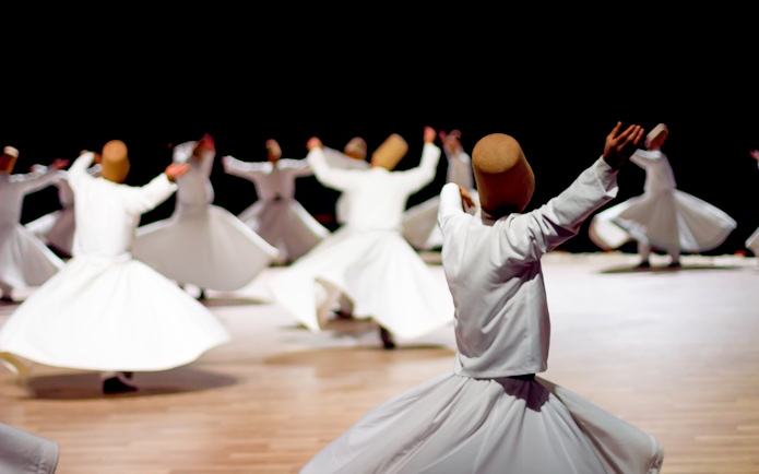 Whirling dervishes performing in Istanbul, Turkey, part of the Istanbul Welcome Card experience.