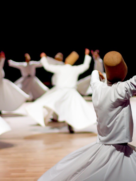 Whirling dervishes performing in Istanbul, Turkey, part of the Istanbul Welcome Card experience.