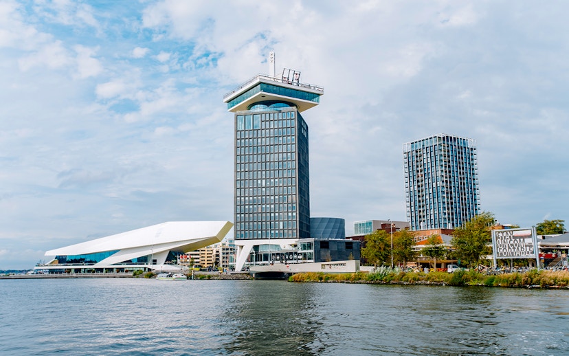 Adam Tower and surrounding buildings by the waterfront in Amsterdam.