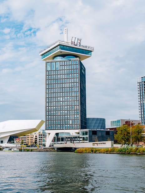 Adam Tower and surrounding buildings by the waterfront in Amsterdam.