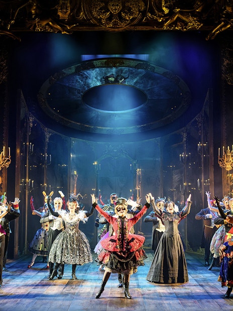 Performers in elaborate costumes on stage during "The Phantom of the Opera" musical in Vienna.