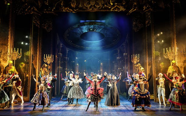 Performers in elaborate costumes on stage during "The Phantom of the Opera" musical in Vienna.