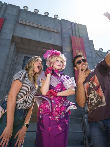 Tourists taking a selfie with a character at the Hunger Games ride, Motiongate Dubai.