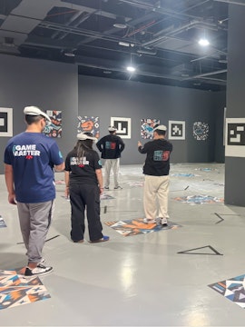 Visitors engaging in a virtual reality experience at Dinosaur Immersive Odyssey, Dubai.