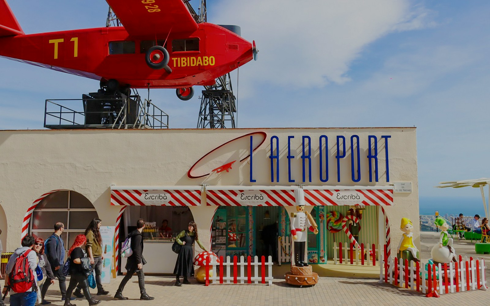 Escribà restaurant entrance at Tibidabo Amusement Park with red airplane display.