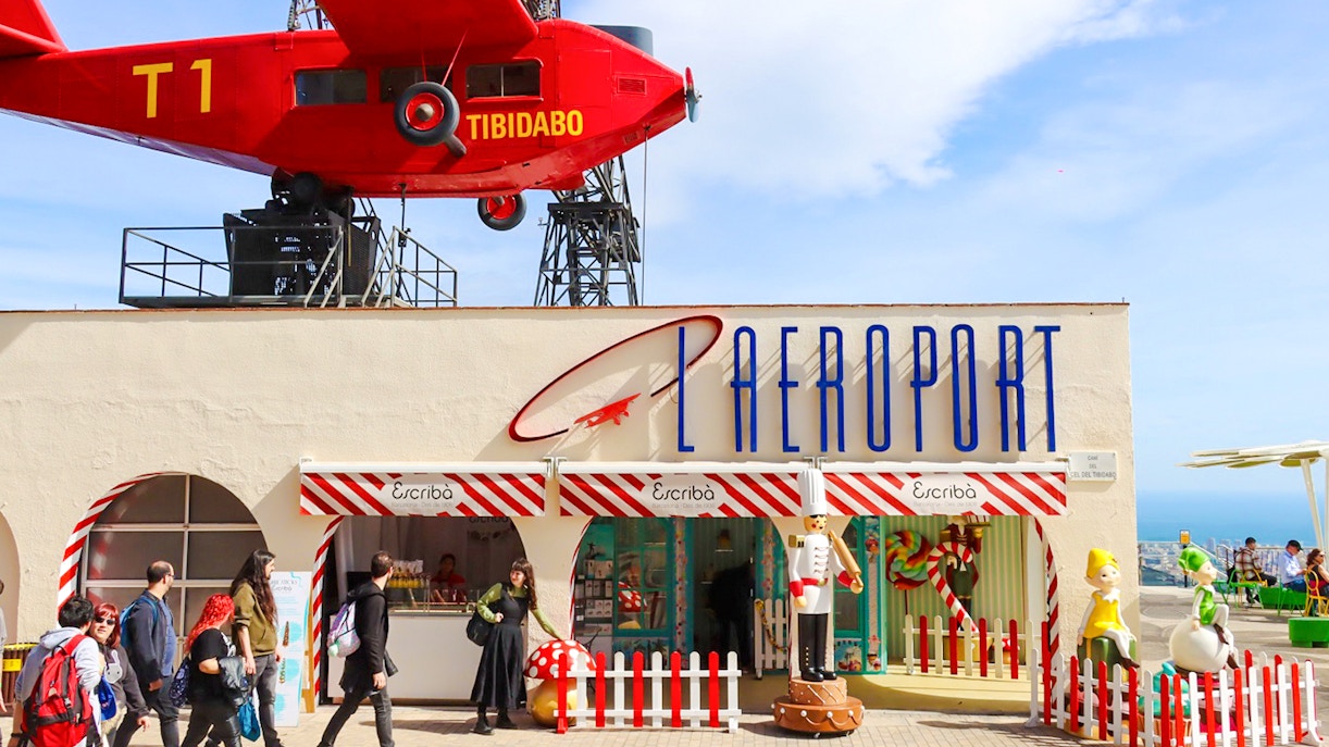 Escribà restaurant entrance at Tibidabo Amusement Park with red airplane display.