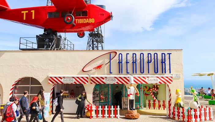 Escribà restaurant entrance at Tibidabo Amusement Park with red airplane display.