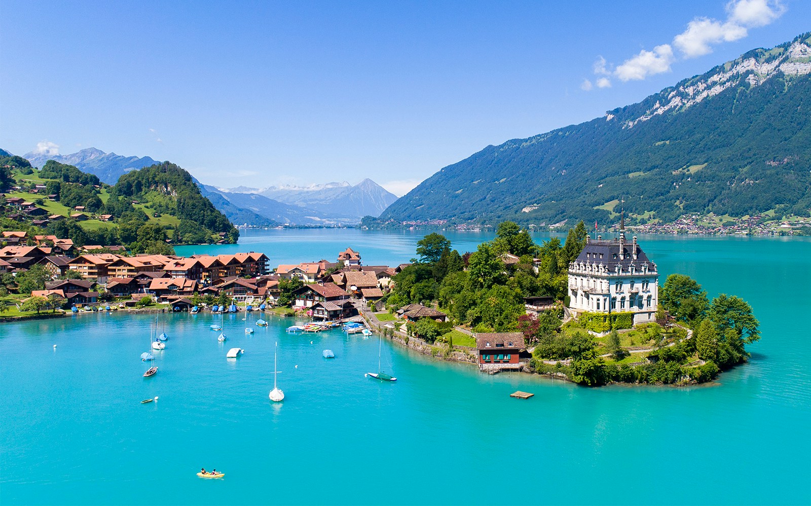 Lake Brienz view from Harder Kulm with surrounding mountains and clear blue water.