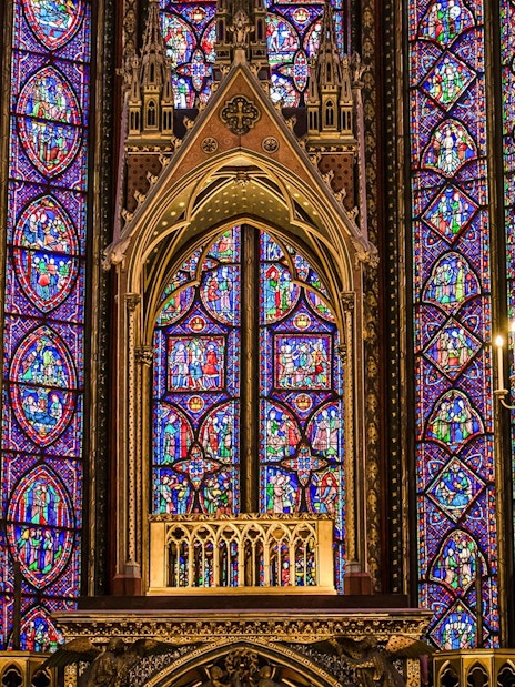 Stained glass windows and chandeliers inside Sainte-Chapelle, Paris.