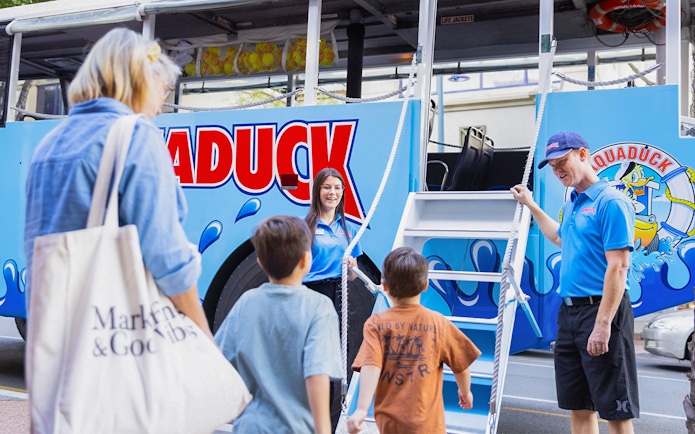 Guests boarding Aquaduck vehicle for city tour and river cruise.