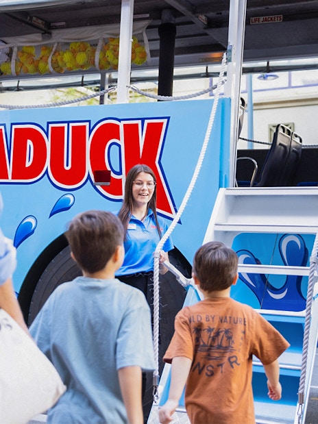 Guests boarding Aquaduck vehicle for city tour and river cruise.