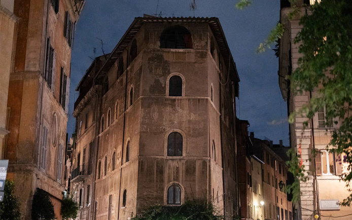 Old building at night on a haunted ghosts tour in Rome.