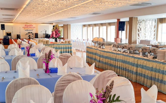 Banquet setup on Riverside Faraya Cruise in Bangkok with dining tables and buffet.