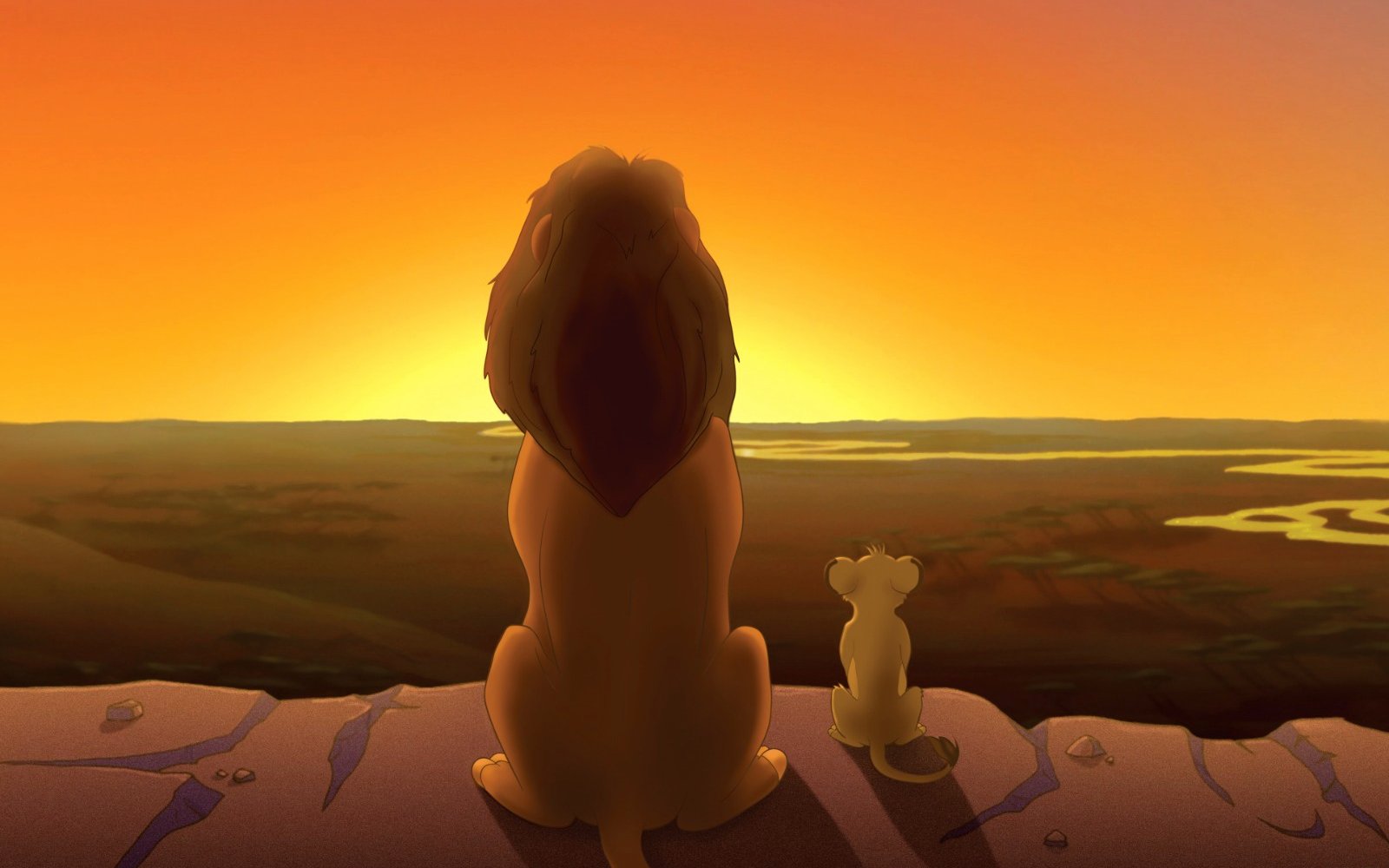 Lion and cub watching sunset over African savanna, scene from Lion King.