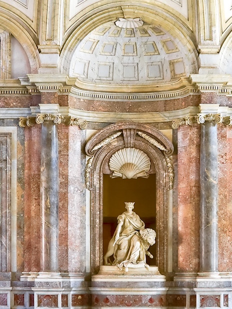 Sculptures atop staircase at Royal Palace of Caserta, Italy.