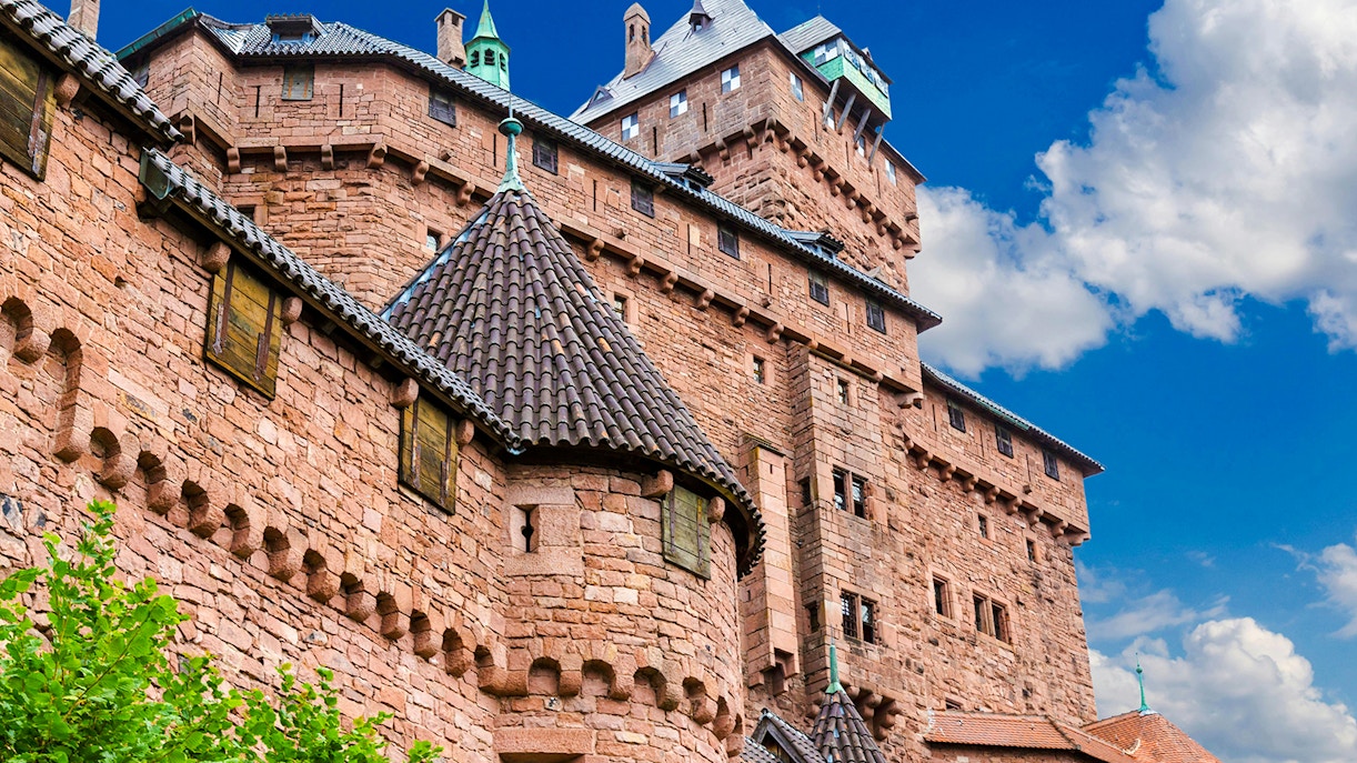 Haut-Koenigsbourg Castle exterior with stone walls and turrets, Alsace, France.