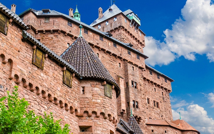 Haut-Koenigsbourg Castle exterior with stone walls and turrets, Alsace, France.
