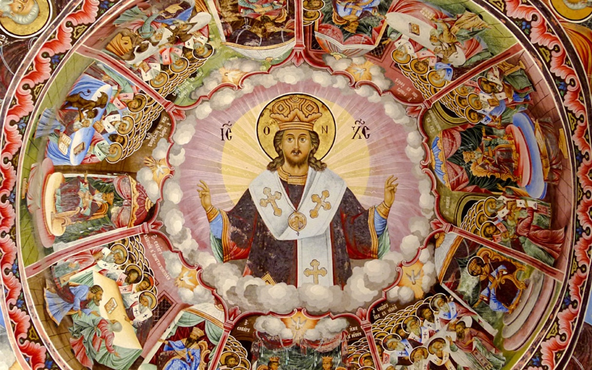 Frescoes depicting religious figures and scenes inside Rila Monastery, Bulgaria.