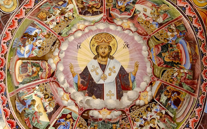 Frescoes depicting religious figures and scenes inside Rila Monastery, Bulgaria.