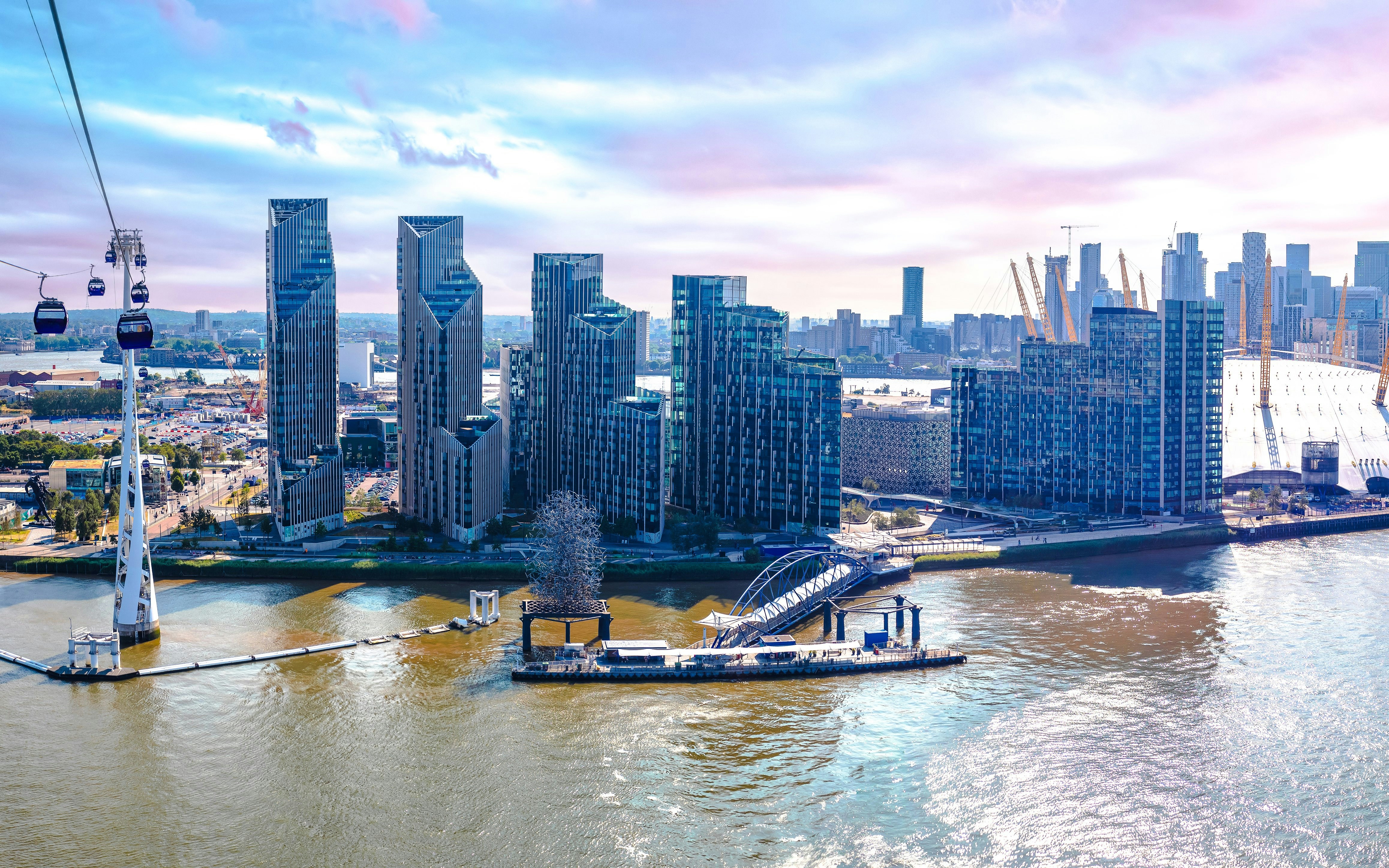 Aerial view of Greenwich Peninsula and Canary Wharf in London from a cable car.