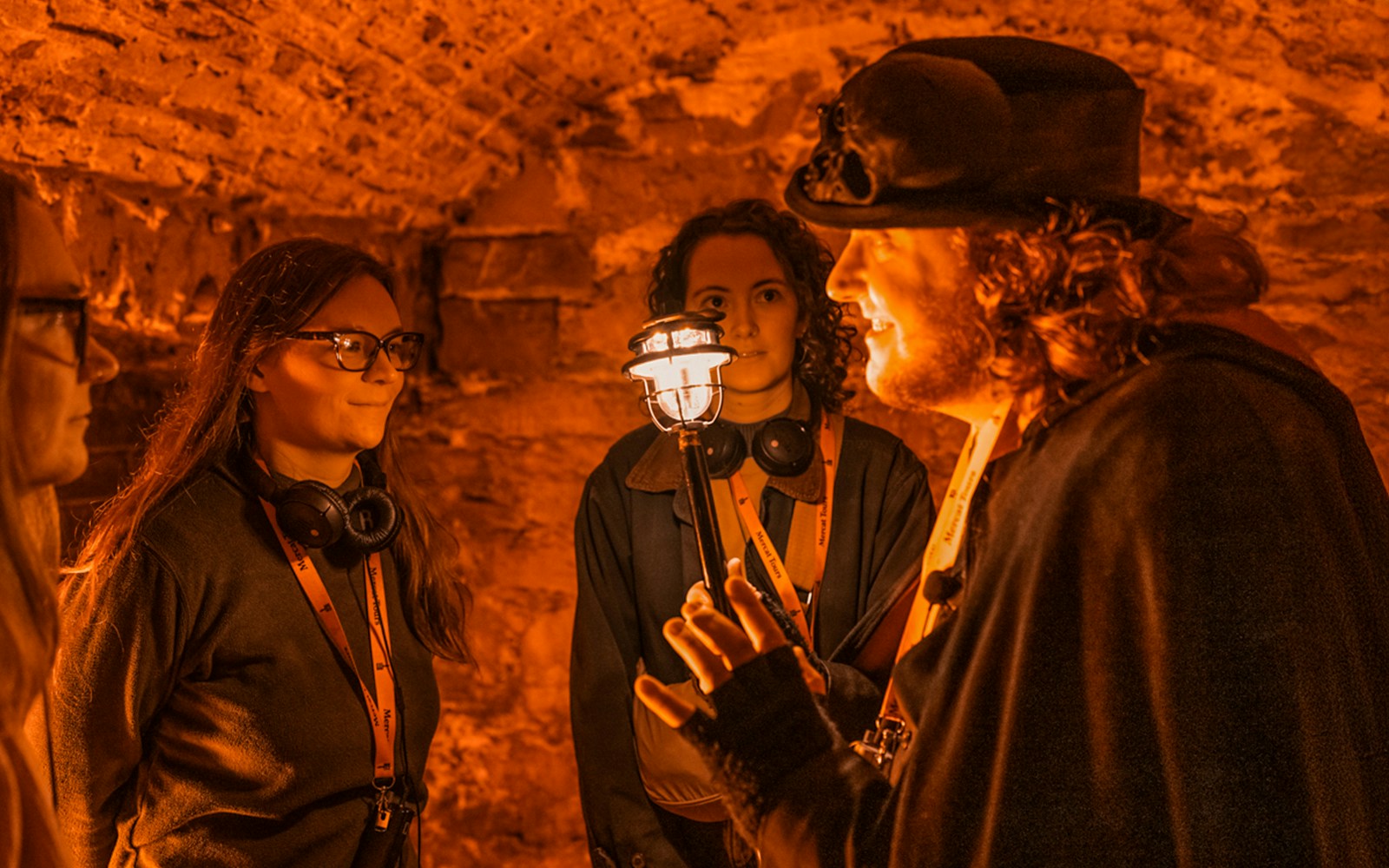 Guide leading a group through Blair Street Underground Vaults.