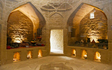 Underground Hamam in Baku with stone arches and traditional decor.