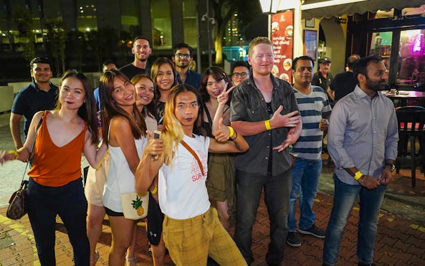 Group enjoying a night out on the Singapore Pub Crawl.