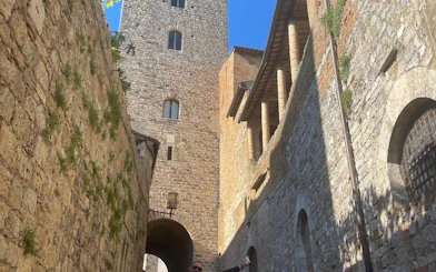 San Gimignano stone tower and medieval architecture on Tuscany day trip.