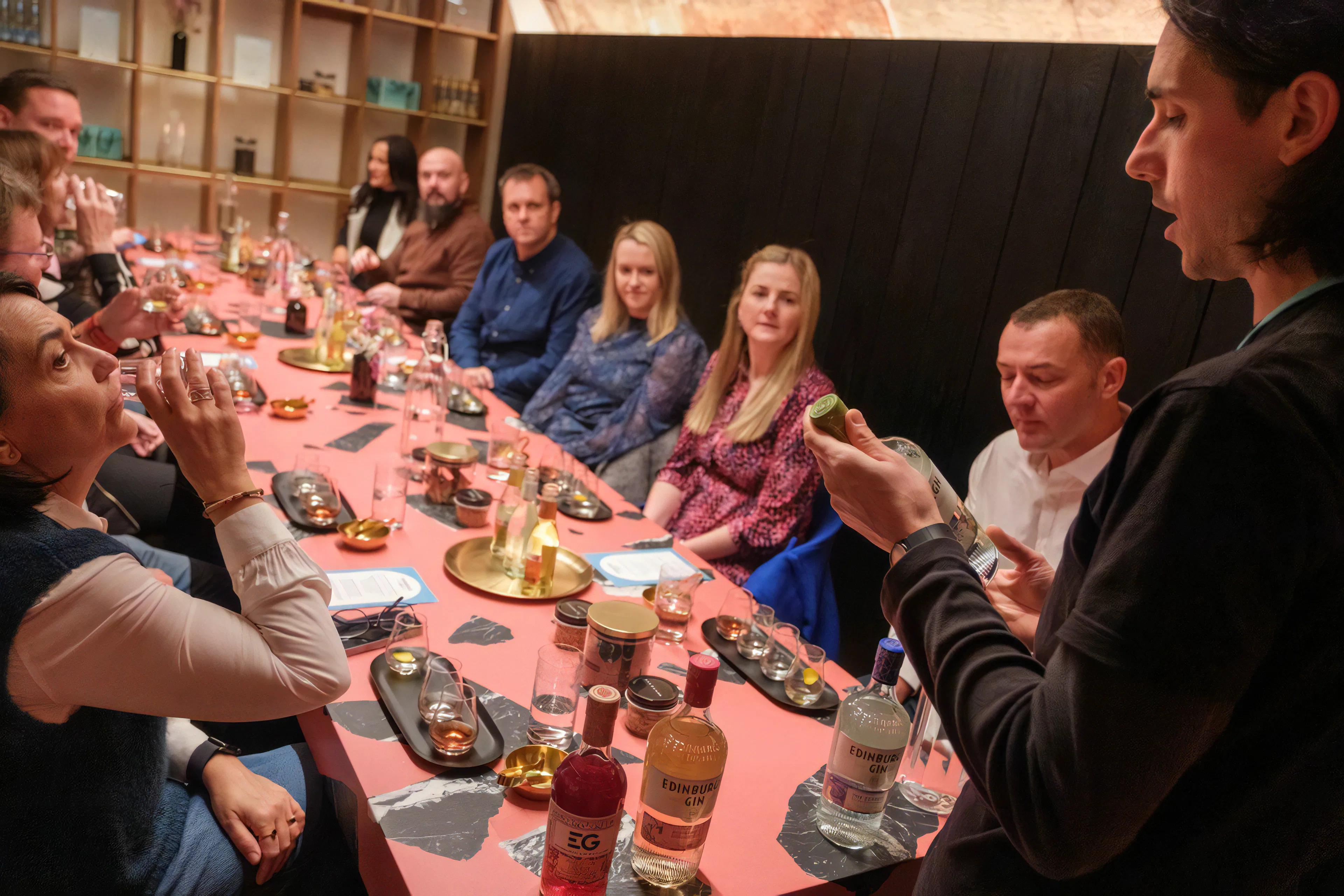Edinburgh distillery tour showcasing whisky barrels and tasting experience.