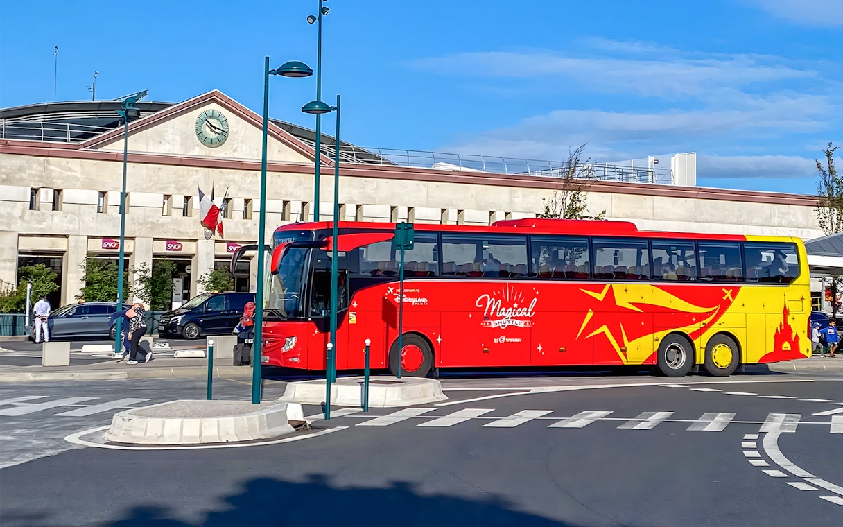 Shuttle bus at Disneyland Paris station for CDG/ORY airport transfer.