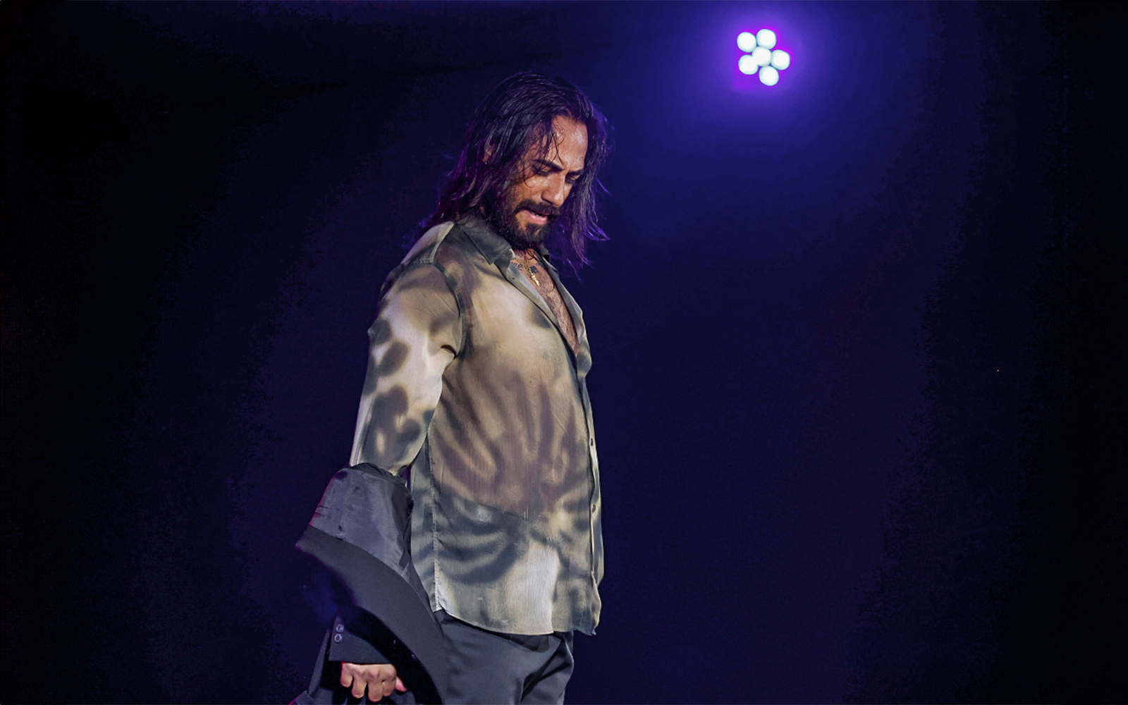 Performer at Flamenco Show in Tablao Flamenco Alma under stage lights.