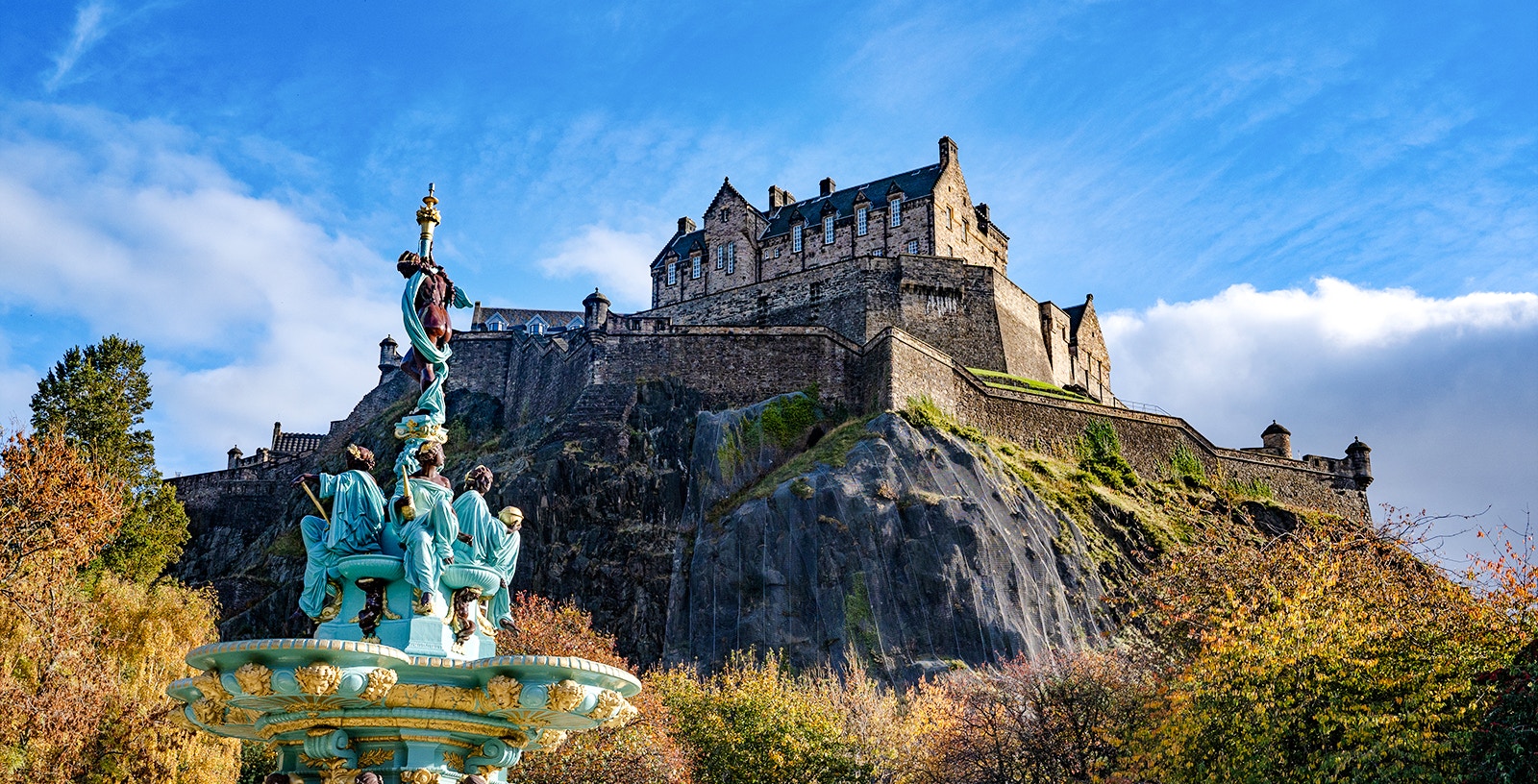 Edinburgh Castle on Castle Rock with Ross Fountain in the foreground, Scotland.