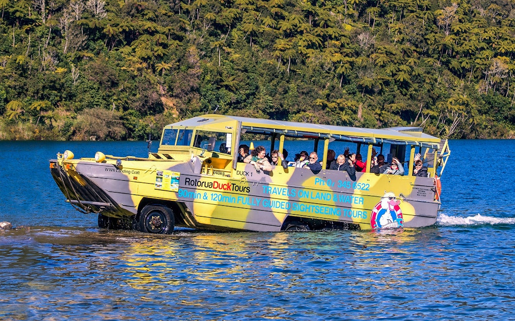 Amphibious tour vehicle on Rotorua Lake with passengers enjoying the Rotorua City & Lakes Tour.