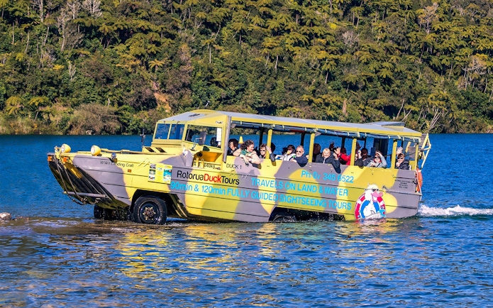 Amphibious tour vehicle on Rotorua Lake with passengers enjoying the Rotorua City & Lakes Tour.