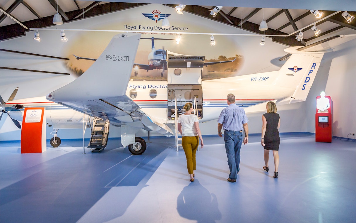 Visitors exploring Royal Flying Doctor Service exhibit in Alice Springs.