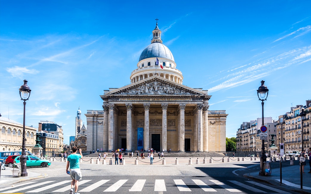 Pantheon in Paris with visitors and surrounding architecture.