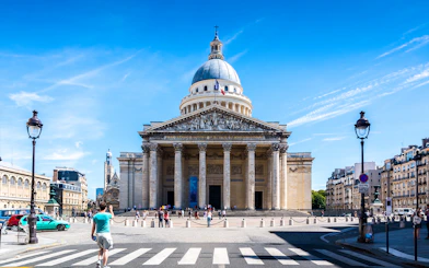 Pantheon in Paris with visitors and surrounding architecture.