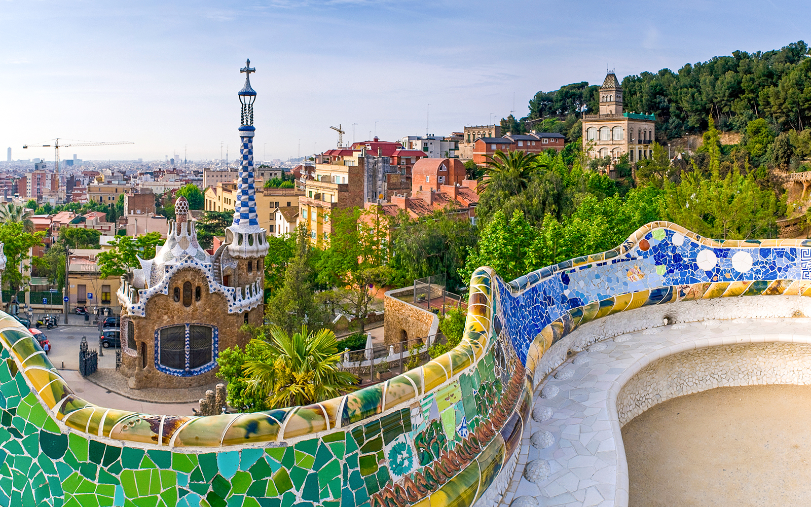 Colorful mosaic terrace and unique architecture at Parc Guell, Barcelona.