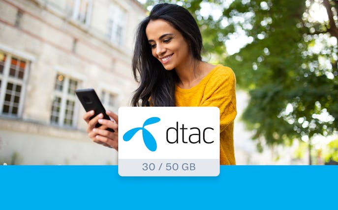 Woman using smartphone with dtac 4G Tourist SIM Card in Bangkok.