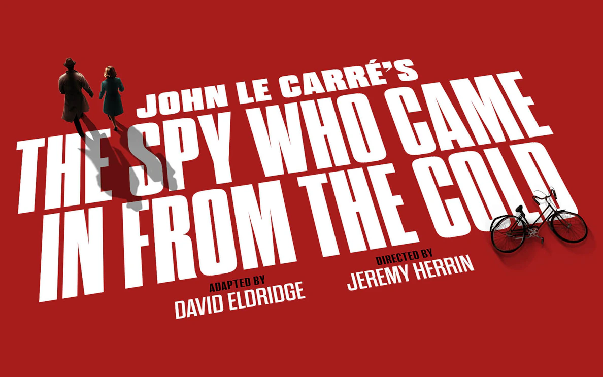 Silhouettes of two figures walking on red background with text 'The Spy Who Came In From The Cold'