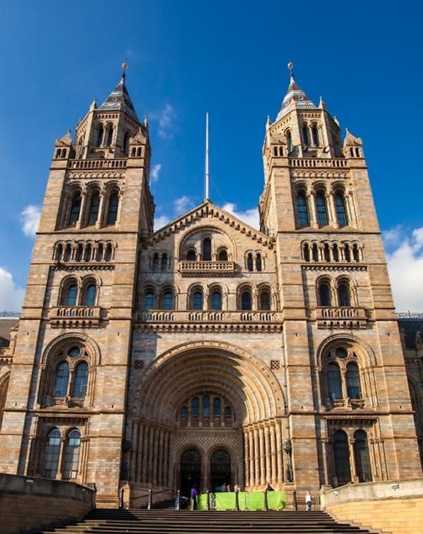 Natural History Museum London entrance with visitors exploring the iconic architecture.